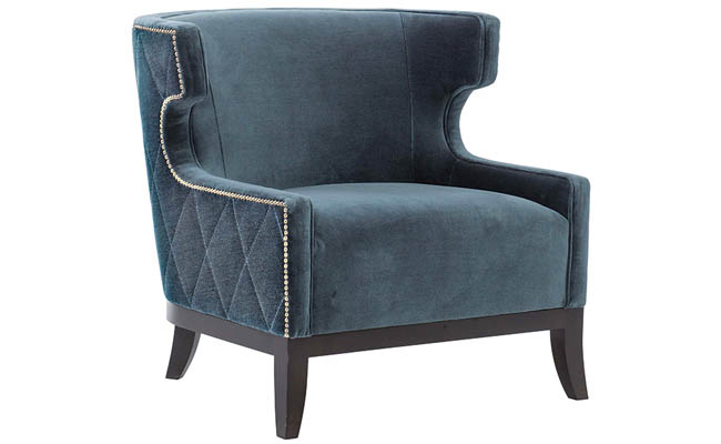 Nailhead trim adds a little sparkle to a blue chair