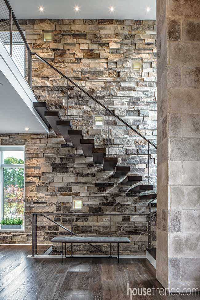 Floating staircase leads to a second floor