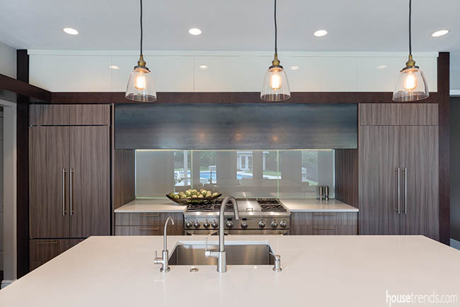 Glass backsplash reflects the outdoors