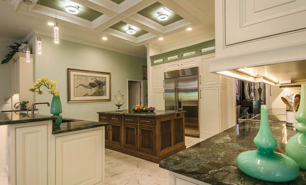 Kitchen remodel uses wall sconces in an unusual place