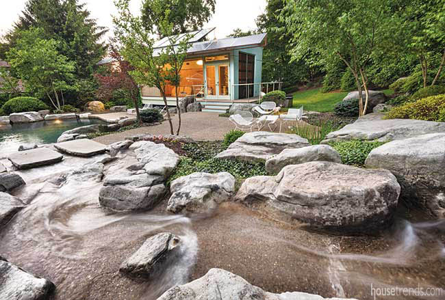 Boulders interrupt a back yard stream