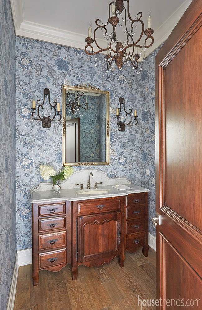Linen covers the walls in a powder room