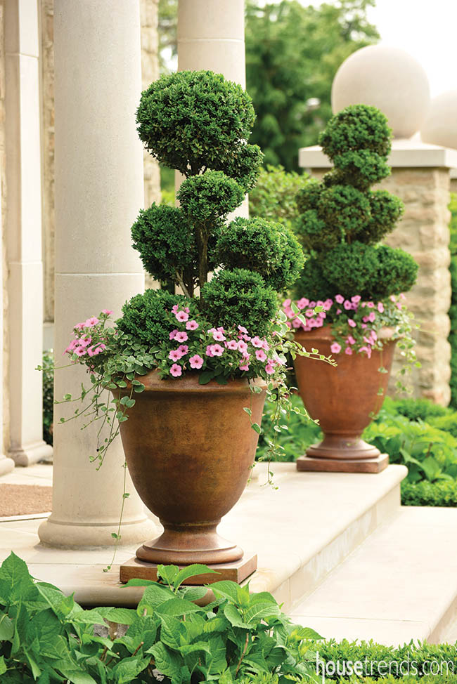 Planters welcome guests to a home