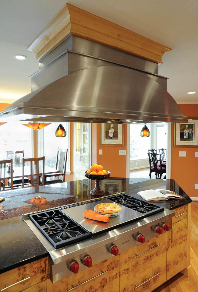 Kitchen design puts the focus on a custom hood