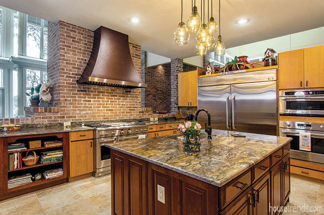 Copper range hood complements oak cabinetry