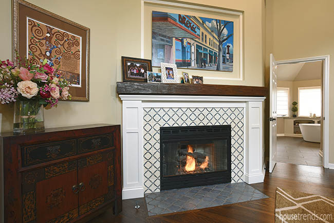 Painting adds color to a tiled fireplace