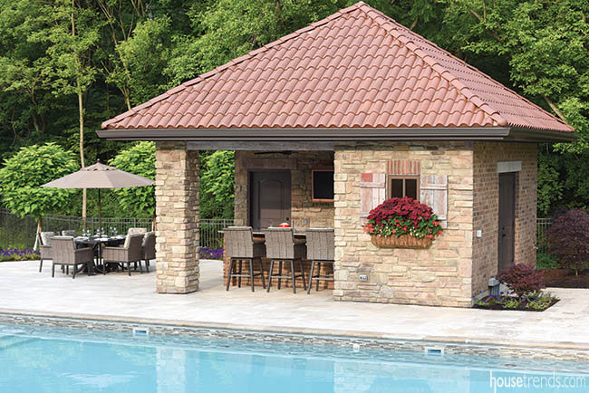 Pool house mimics the design of the main house