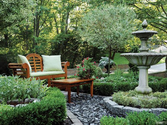 Outdoor furniture overlooks an herb garden
