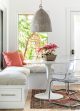 Unique chandelier dangles over a breakfast nook