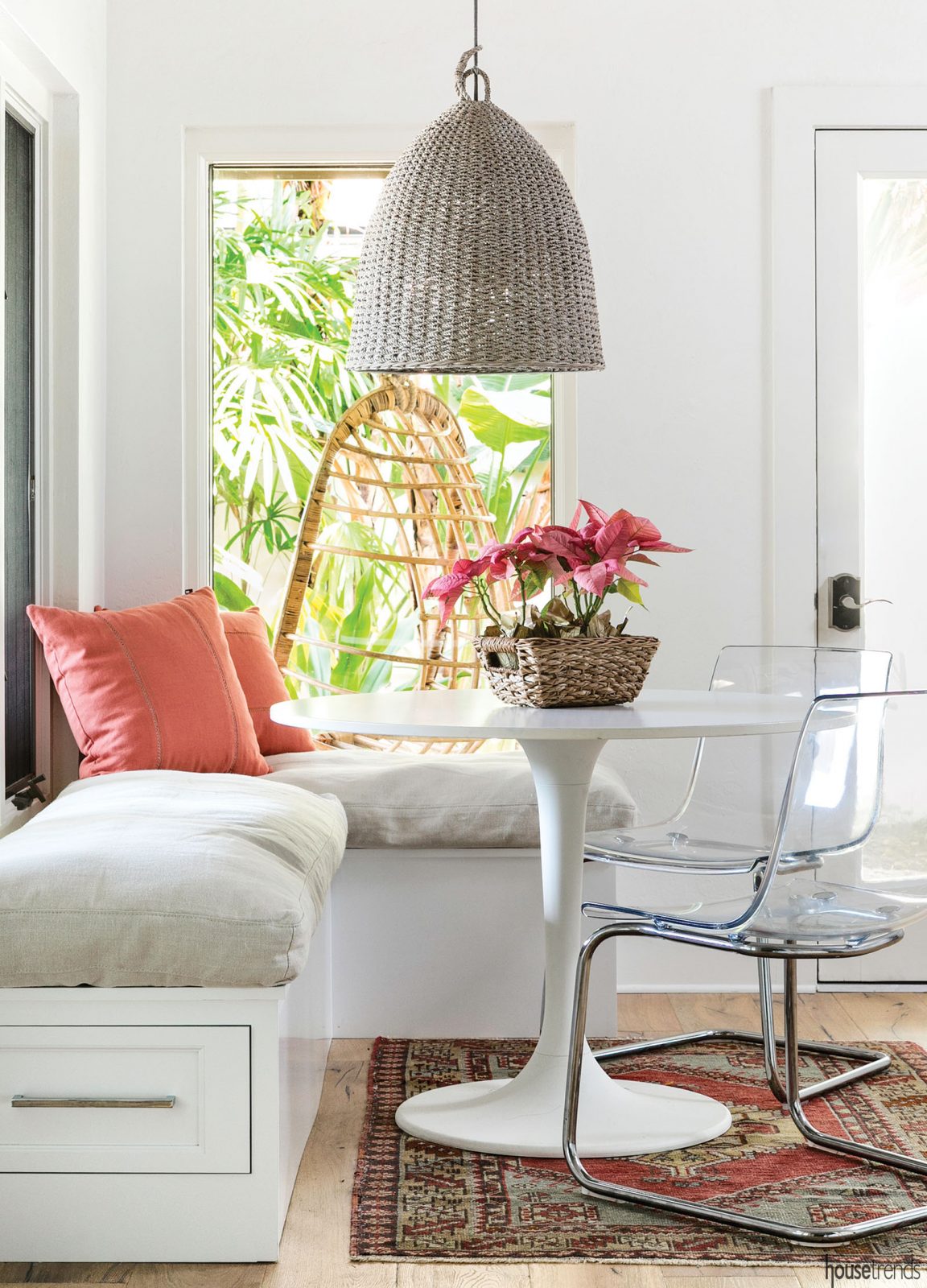 Unique chandelier dangles over a breakfast nook