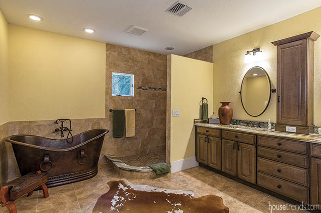 Renovated master bathroom boasts a copper tub