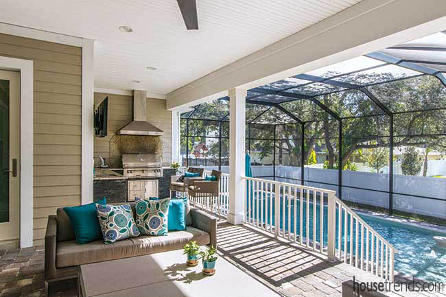 Outdoor kitchen overlooks a pool
