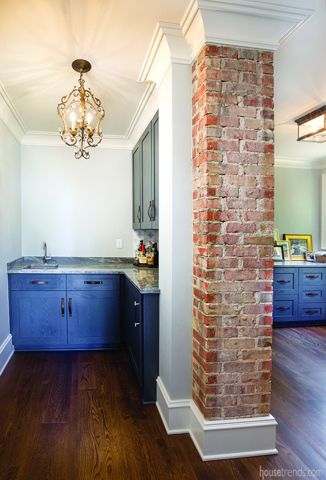 Wet bar is tucked next to an original chimney