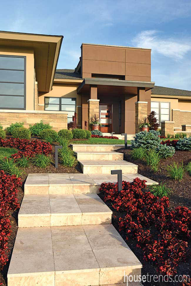 Colorful begonias soften a contemporary facade