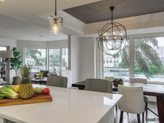 Orbit light fixture lights up a dining area