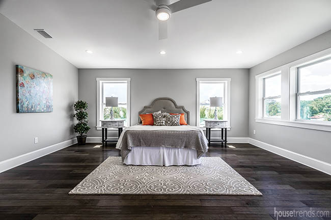 Windows lend plenty of light to a master bedroom