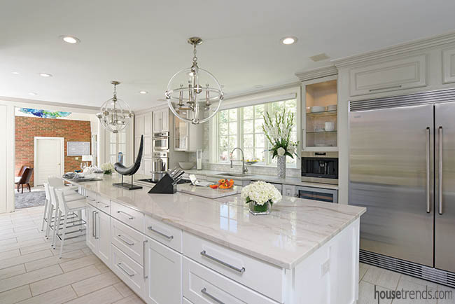 Kitchen flows directly into a sunroom
