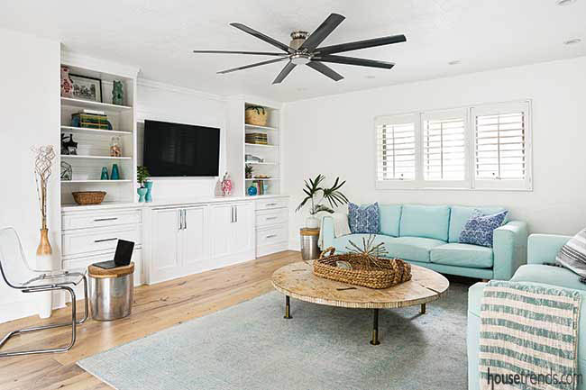 White cabinetry adds storage to a family room
