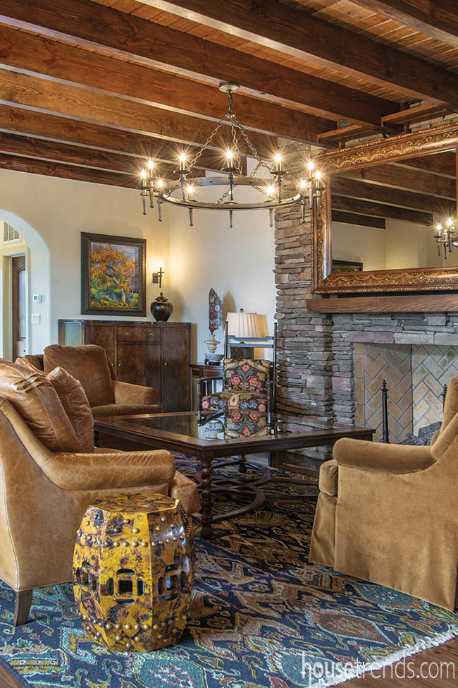 Wood ceiling complements a stone fireplace
