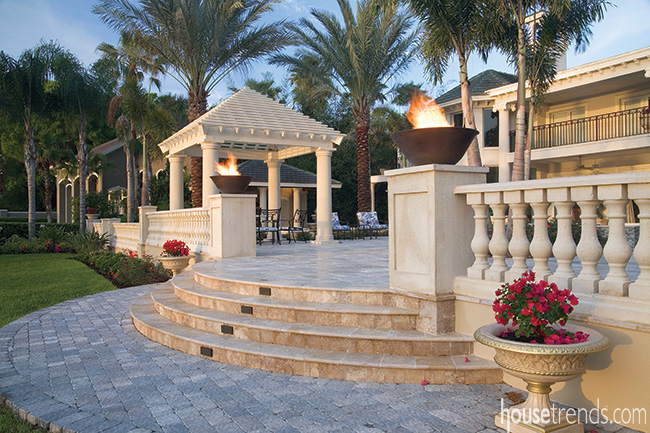 Elegant wall separates a patio and lawn