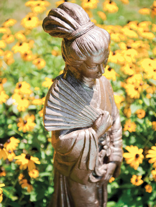 Lawn ornaments add a touch of whimsy to a garden