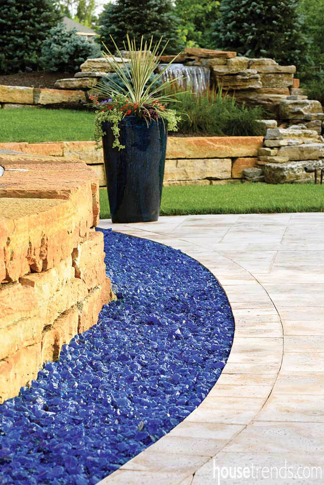 Blue glass mulch adds color to a back yard
