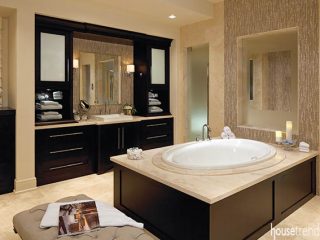 Glass wall affords privacy to soaking tub