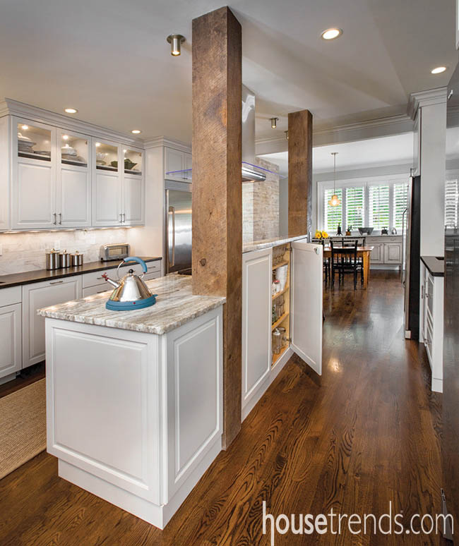 Repurposed beams give a kitchen design a rustic look