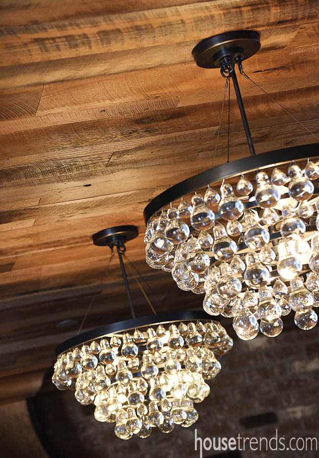 Chandeliers make a kitchen island pop