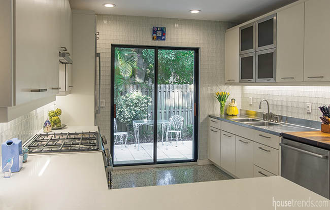 Kitchen backsplash and wall covered in same tile