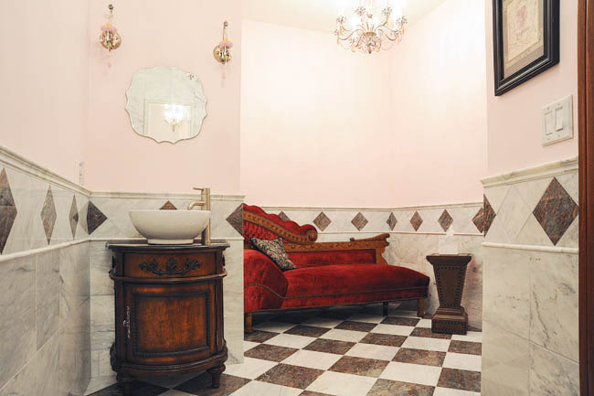 Bathroom design is centered around antique furniture