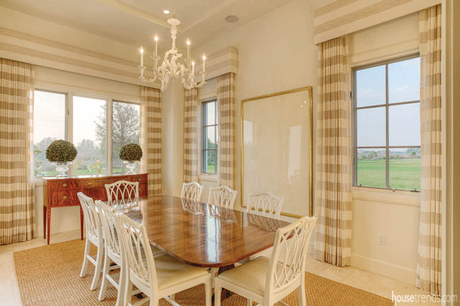 Window treatments soften a dining room design