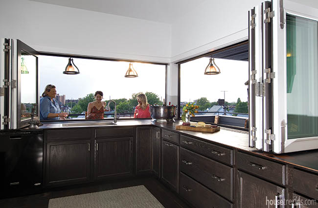 Windows fold open to welcome warm weather