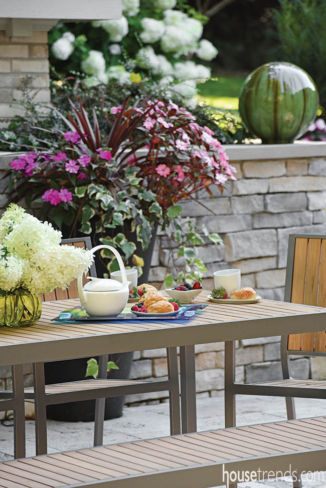 Teak patio furniture complements a simple design