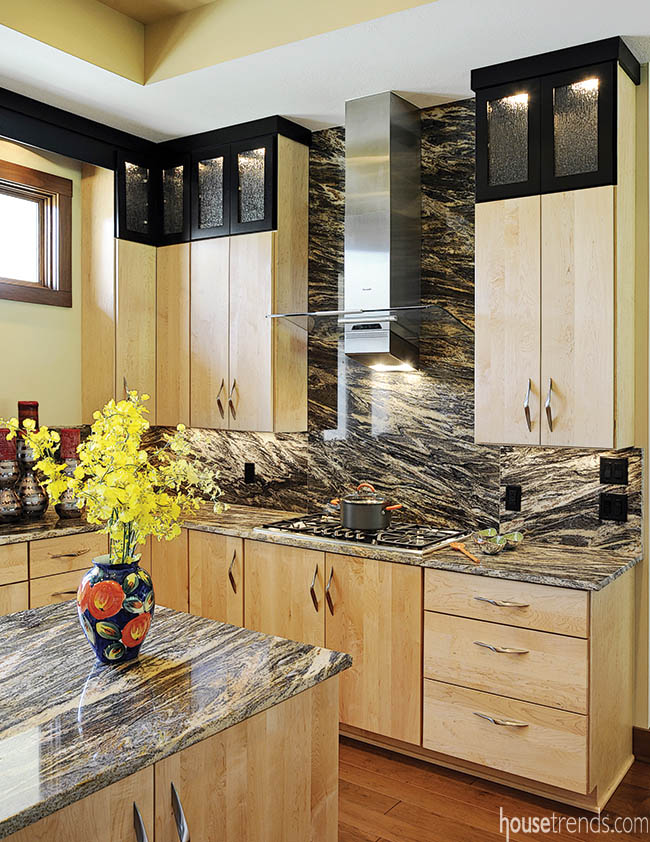 Granite countertops carry over to the backsplash