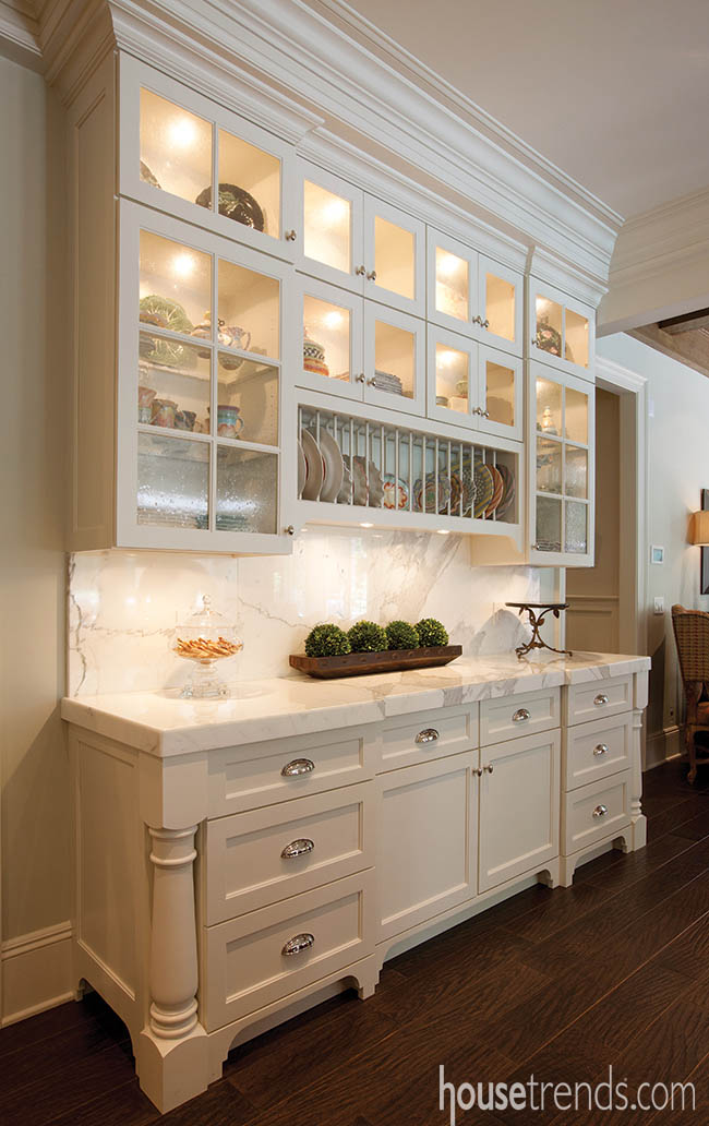 Cabinetry pulls double duty for storage and presentation