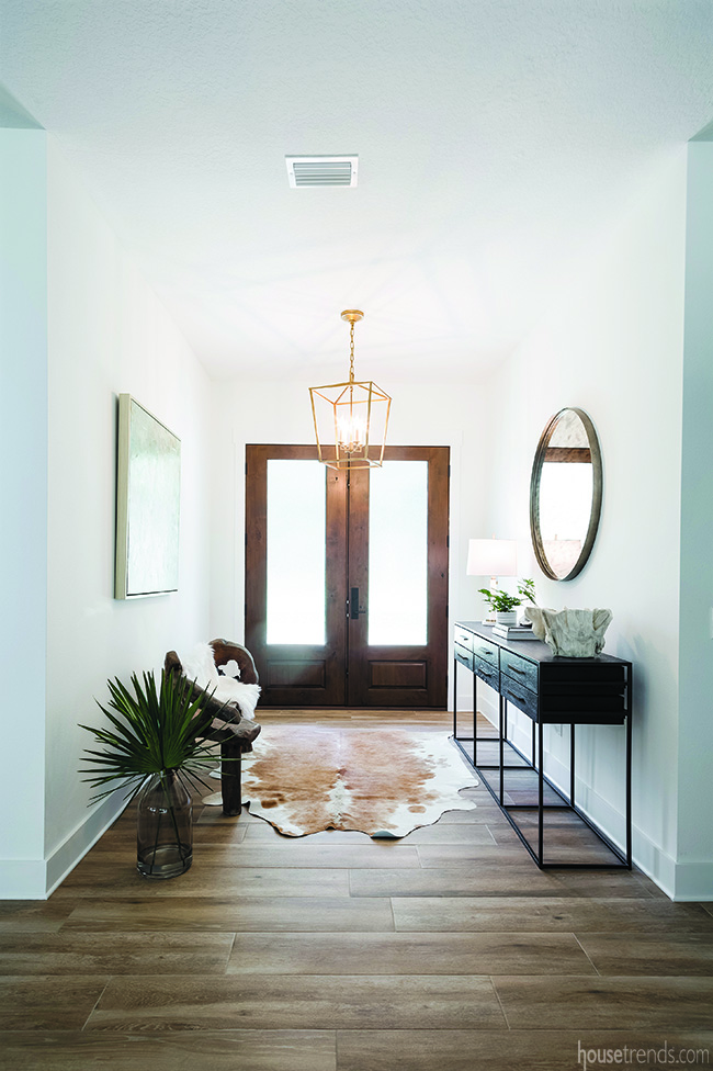 Brass chandelier illuminates an entryway