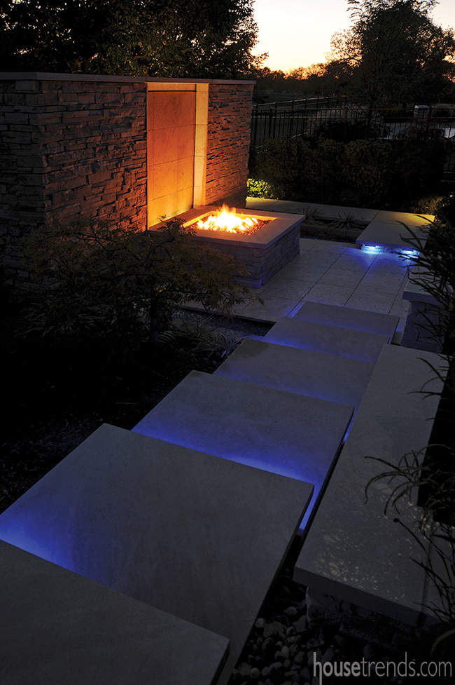 Outdoor lighting leads to a fire pit