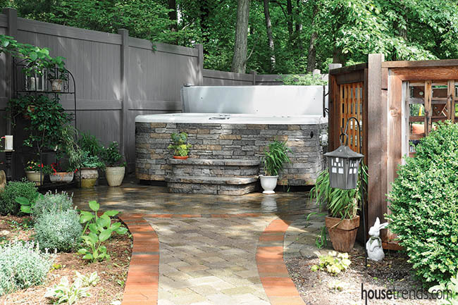 Landscape design camouflages a hot tub