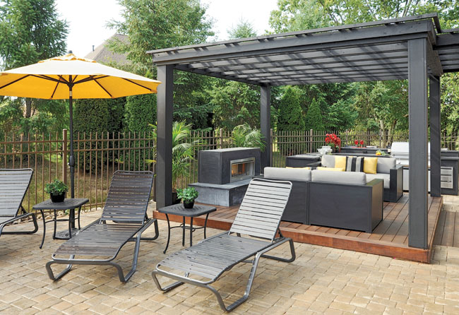 Cozy up to the fireplace with this outdoor furniture