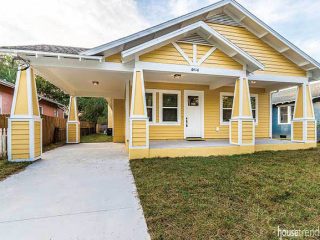 Bungalow features a yellow facade