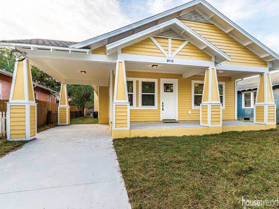 Bungalow features a yellow facade