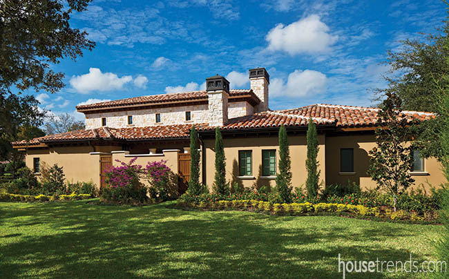 Sprawling landscape surrounds a Tuscan home design