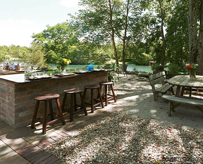 Outdoor bar stools provide seating in a back yard