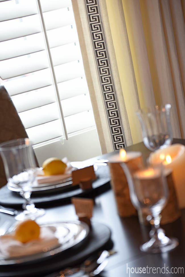 Window treatments boast a Greek key pattern