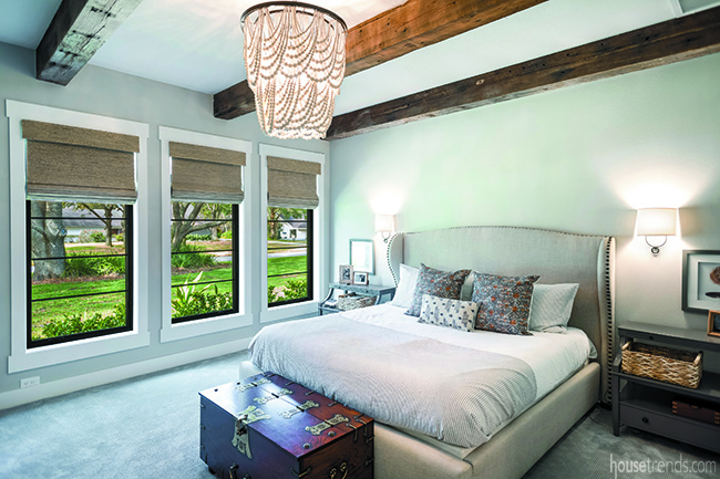 Dramatic chandelier in a master bedroom