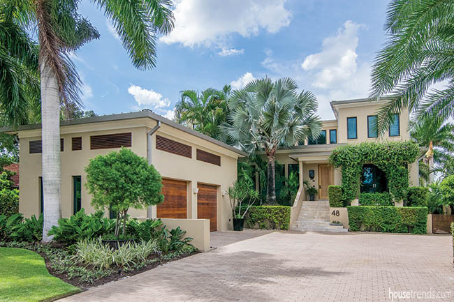 Glass and low rooflines define a home's design
