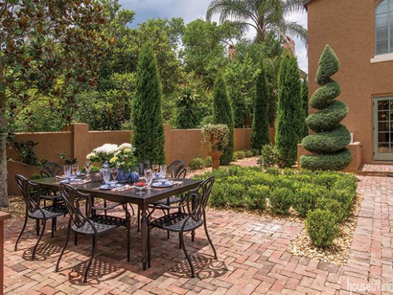 Brick courtyard hosts an outdoor dining area