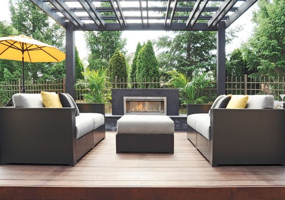 Outdoor kitchen complements a contemporary sitting area