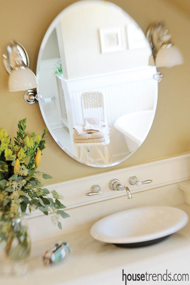 Oval mirrors add charm to a master bath